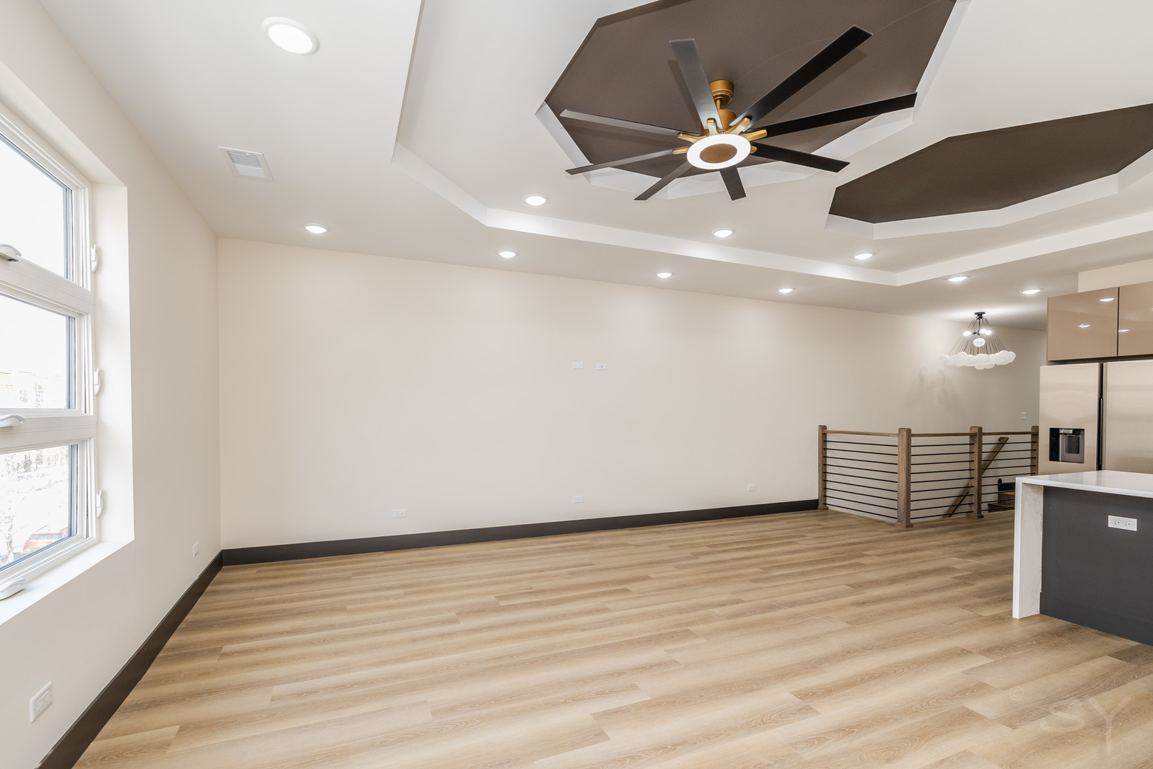 5643 South Prairie Avenue, Unit 1 Chicago, IL 60637 - Photo 7 of 15 an empty room with wooden floor and windows