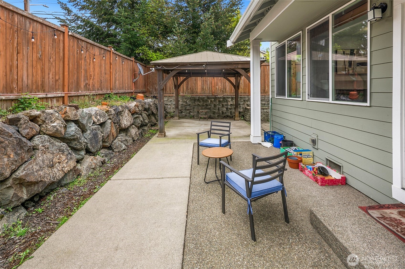 3931 177th Street Southeast Bothell, WA 98012 - Photo 32 of 39 a backyard of a house with yard fire pit and outdoor seating