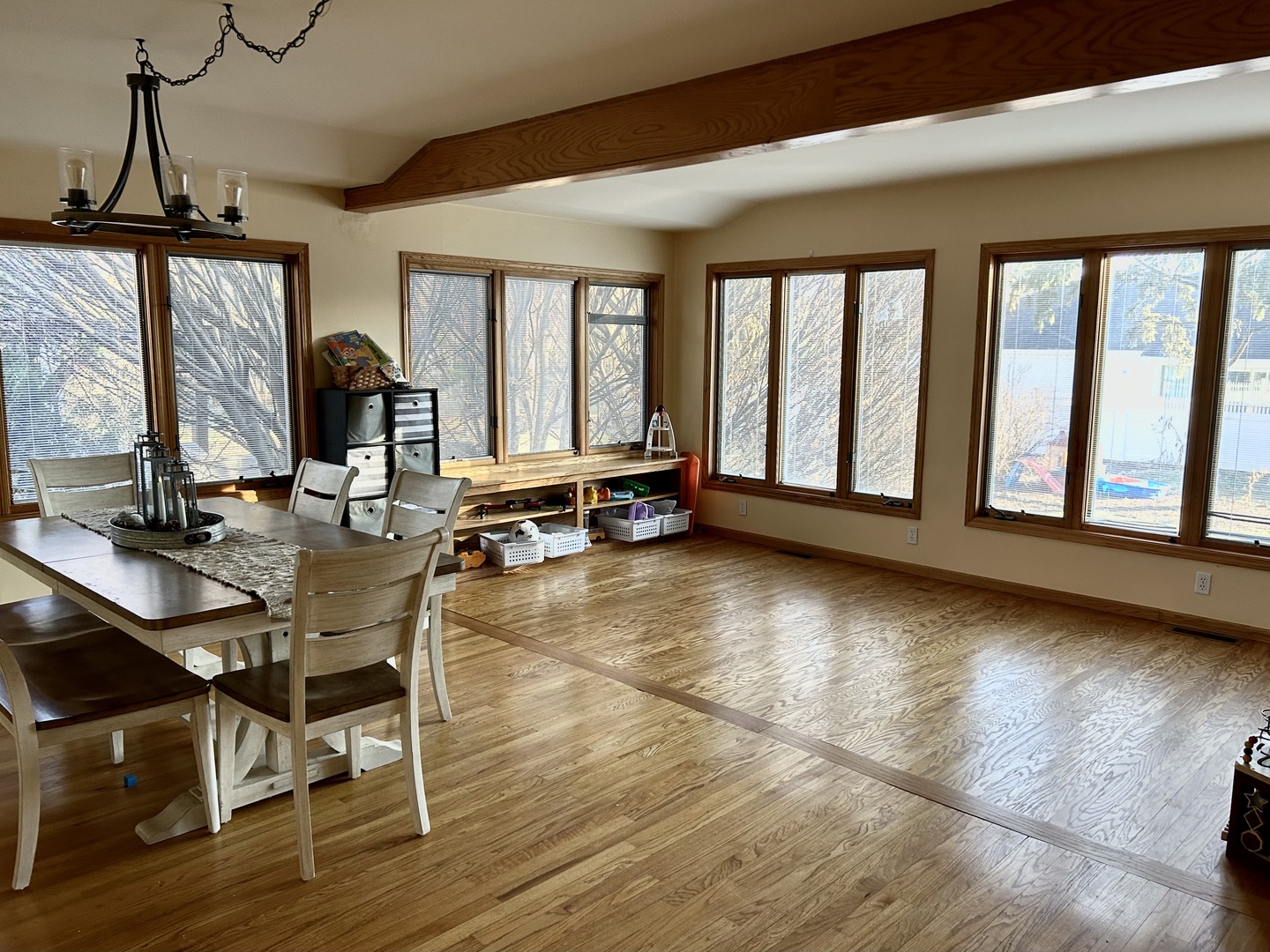 428 East Thompson Street Princeton, IL 61356 - Photo 3 of 22 a dining room with wooden floor and a floor to ceiling window