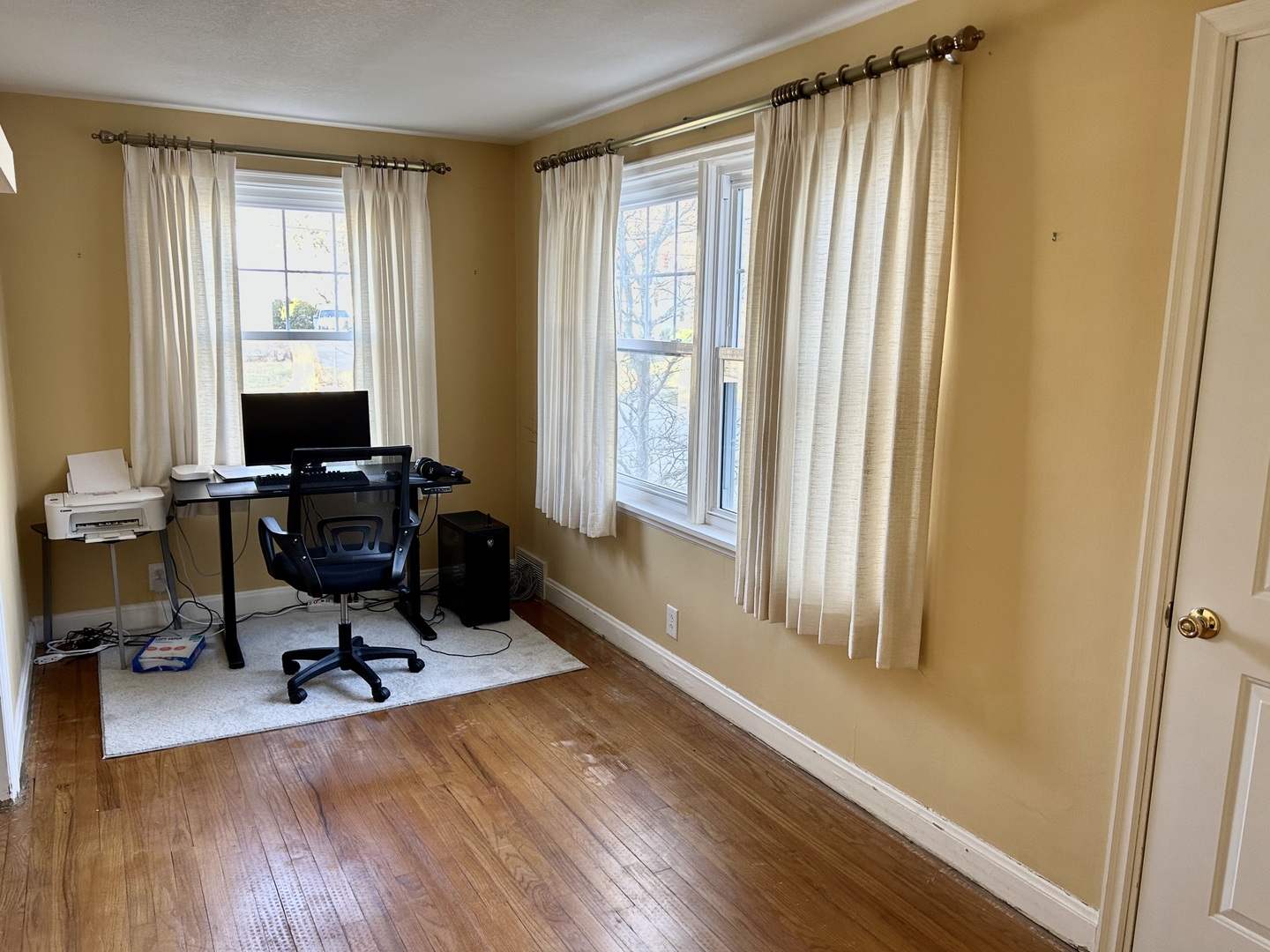 428 East Thompson Street Princeton, IL 61356 - Photo 6 of 22 a view of a workspace with furniture and a window