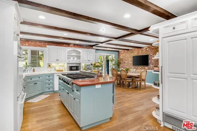 a kitchen with a stove and a refrigerator