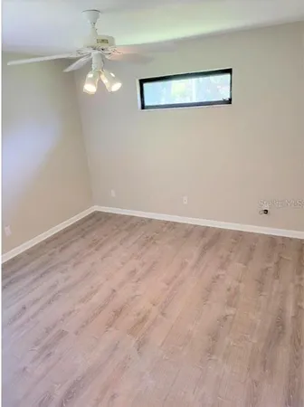 en empty room with wooden floor