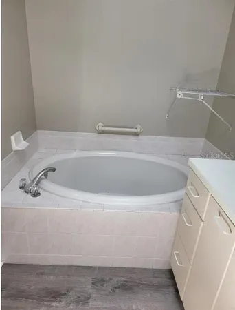 a white bath tub sitting in a bathroom