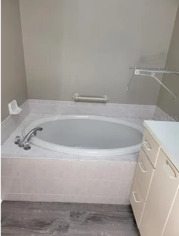a white bath tub sitting in a bathroom