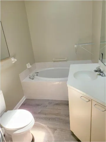 a bathroom with a toilet and a sink