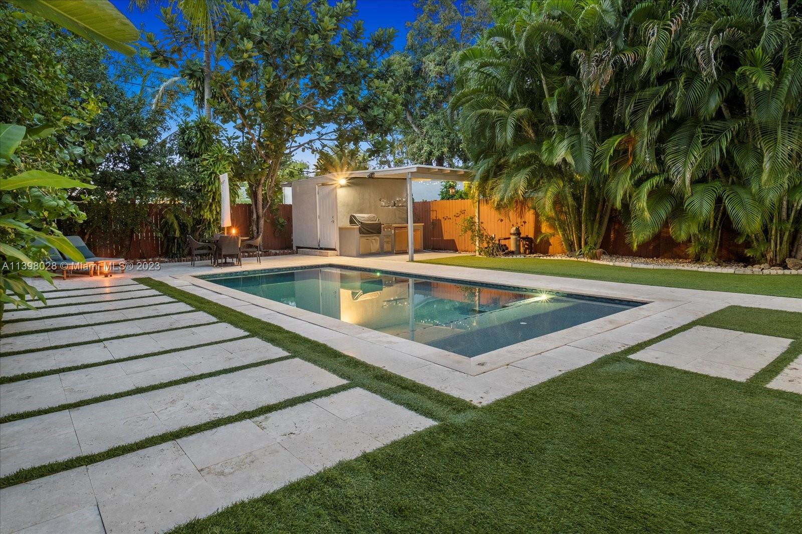 443 Northeast 71st Street Miami, FL 33138 - Photo 1 of 22 a view of a backyard with swimming pool
