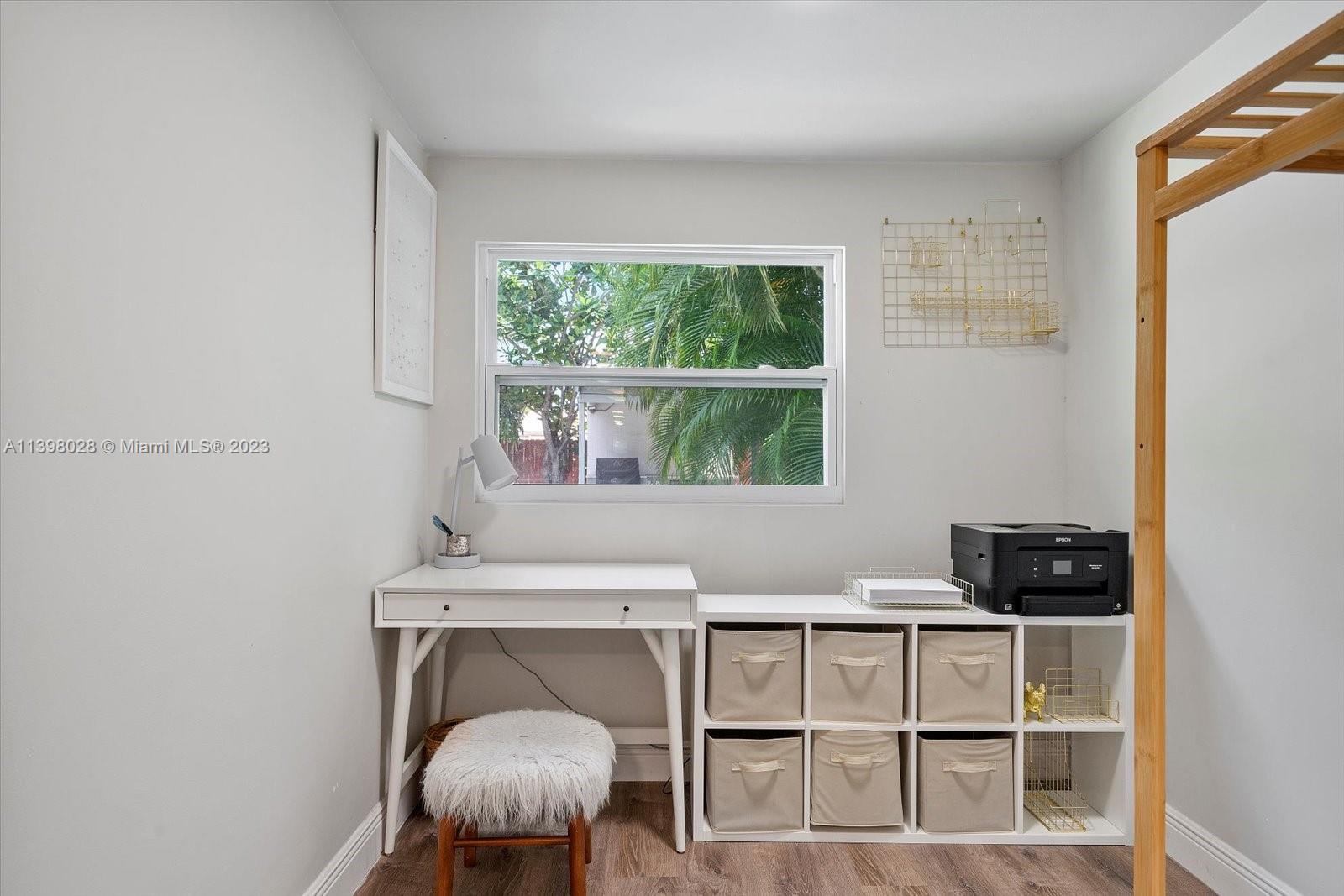 443 Northeast 71st Street Miami, FL 33138 - Photo 15 of 22 a living room with a window and a wooden floor