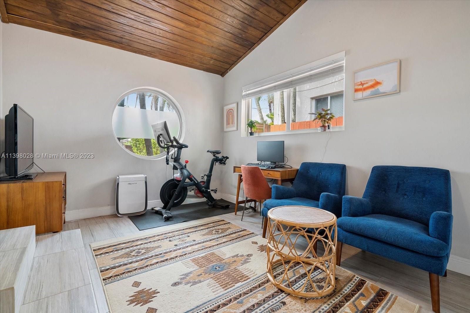 443 Northeast 71st Street Miami, FL 33138 - Photo 16 of 22 a living room with furniture a rug and a window