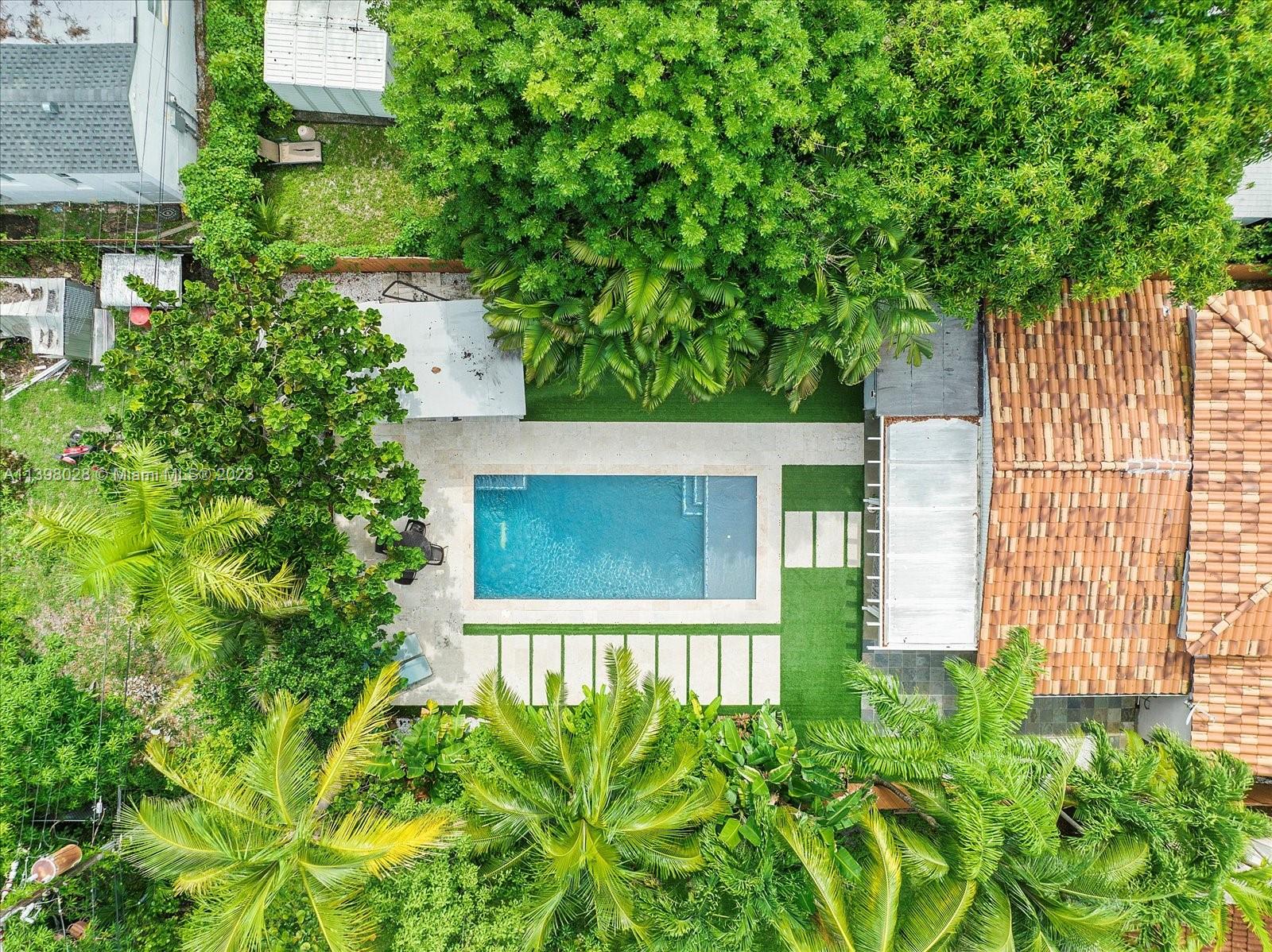 443 Northeast 71st Street Miami, FL 33138 - Photo 20 of 22 a view of a house with a small yard
