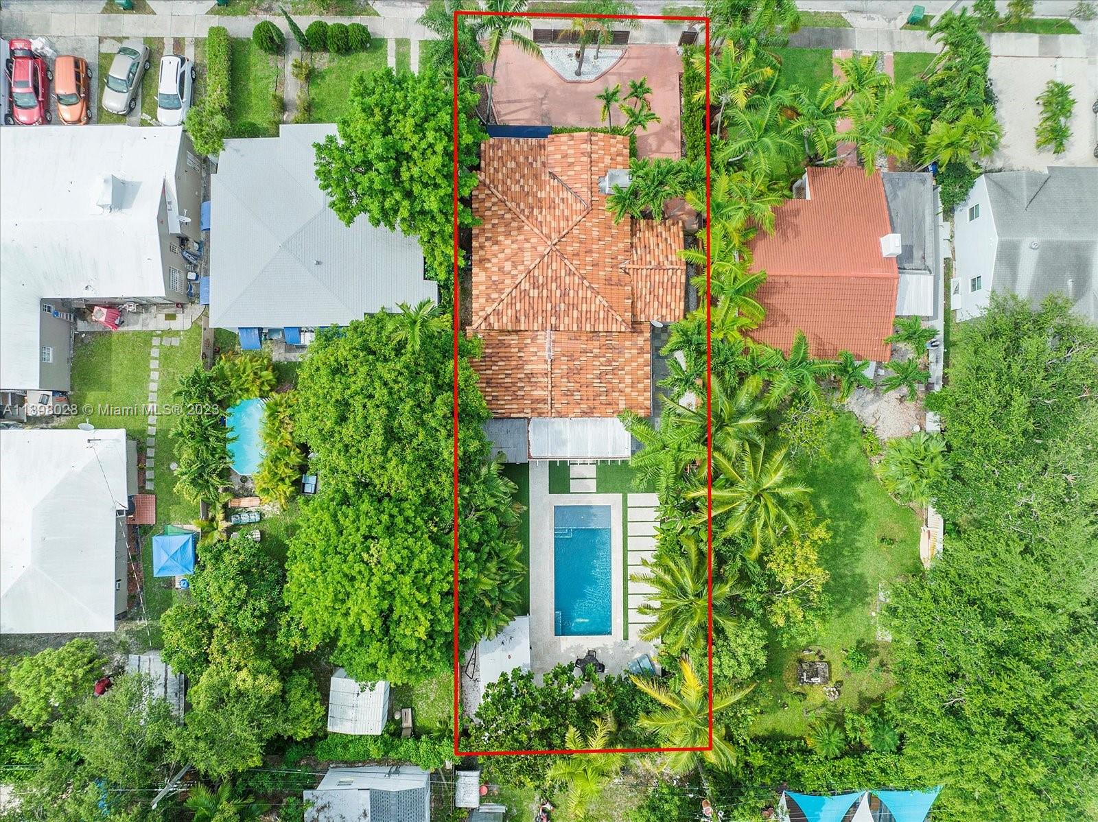 443 Northeast 71st Street Miami, FL 33138 - Photo 21 of 22 an aerial view of house with yard and swimming pool