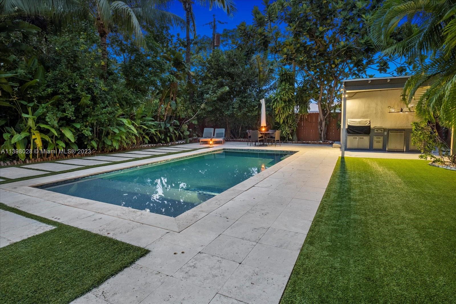 443 Northeast 71st Street Miami, FL 33138 - Photo 9 of 22 a view of a swimming pool with a sitting area