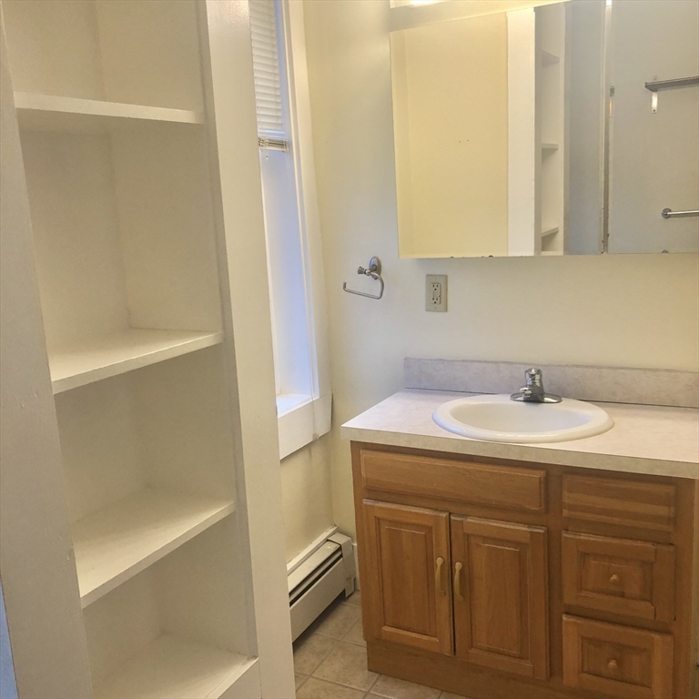 27 High Street, Unit 1 Clinton, MA 01510 - Photo 15 of 30 a bathroom with a sink and a mirror