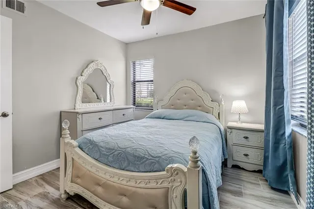 a bedroom with a bed and a mirror