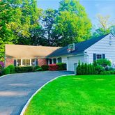 a view of a yard in front of a house