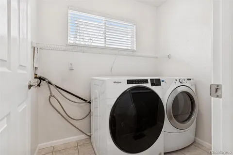 a view of a room with workspace and windows