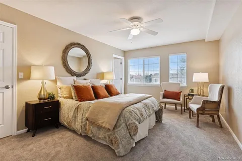 a bedroom with a bed and a lamp