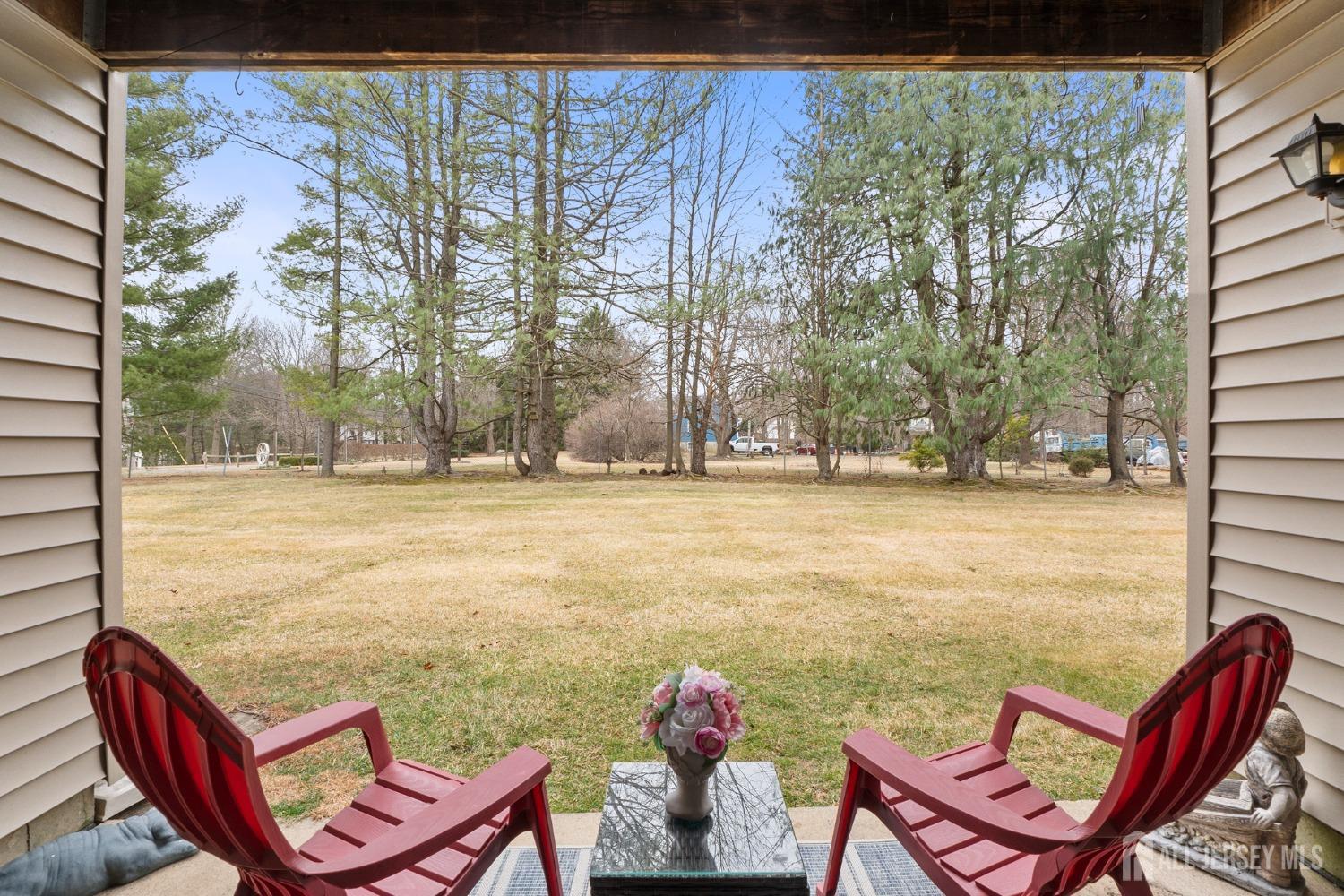 9 Lindsey Circle Old Bridge, NJ 08857 - Photo 11 of 23 a view of swimming pool with lawn chairs and wooden fence