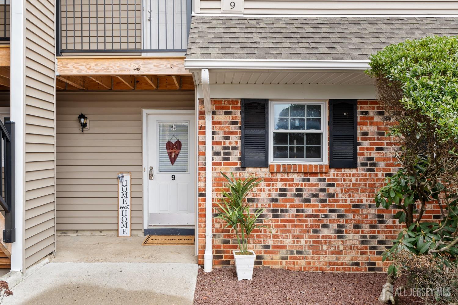 9 Lindsey Circle Old Bridge, NJ 08857 - Photo 2 of 23 a front view of a house with a garage