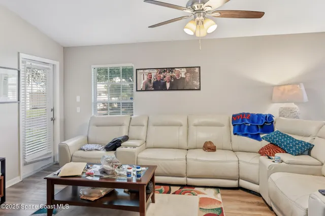 a living room with furniture and window