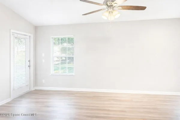 a view of an empty room with a window
