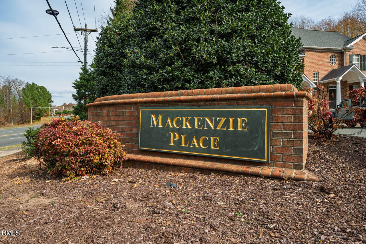 18 Scottish Lane Durham, NC 27707 - Photo 25 of 27 a sign that is sitting on a brick wall