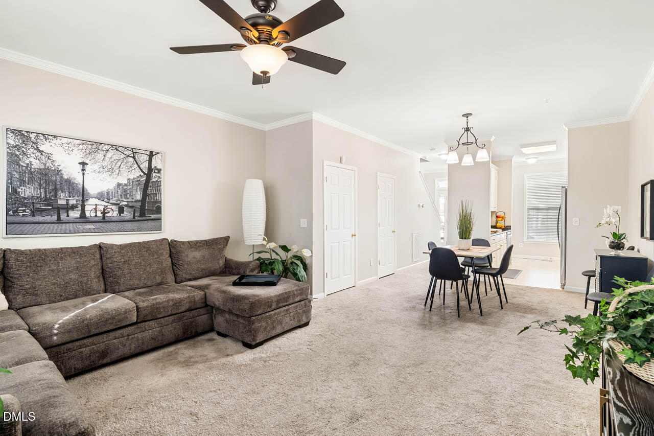 18 Scottish Lane Durham, NC 27707 - Photo 4 of 27 a living room with furniture and a chandelier
