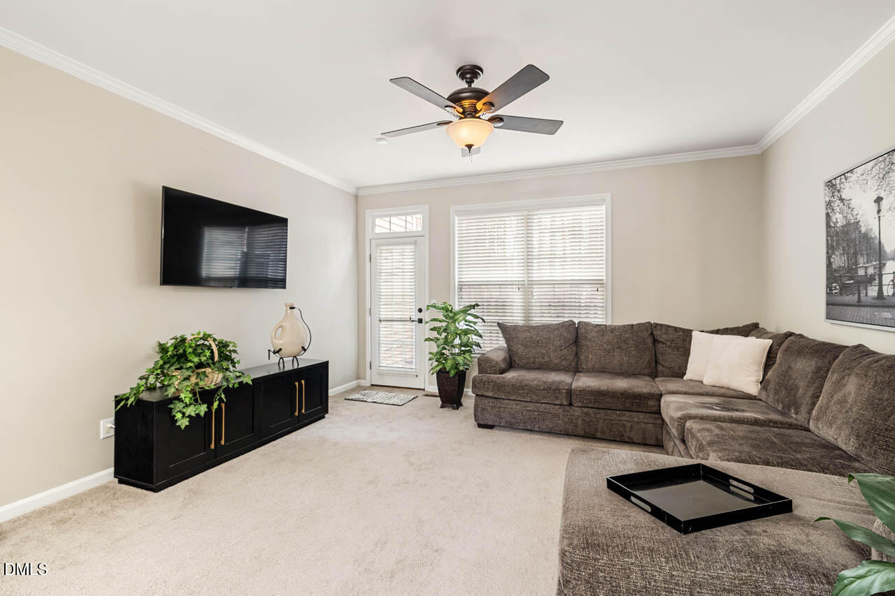 18 Scottish Lane Durham, NC 27707 - Photo 6 of 27 a living room with furniture potted plant and a window