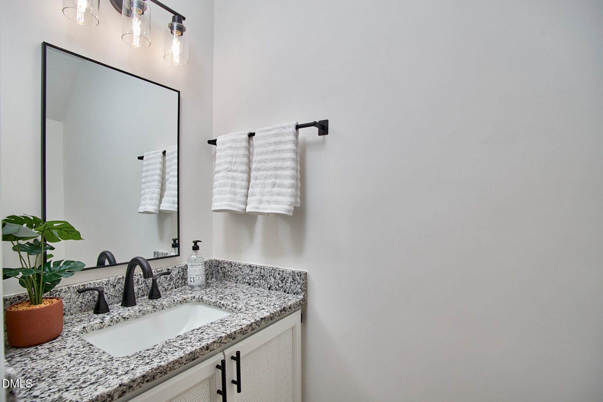 30 Fashion Place Durham, NC 27705 - Photo 18 of 30 a bathroom with a granite countertop sink and a mirror