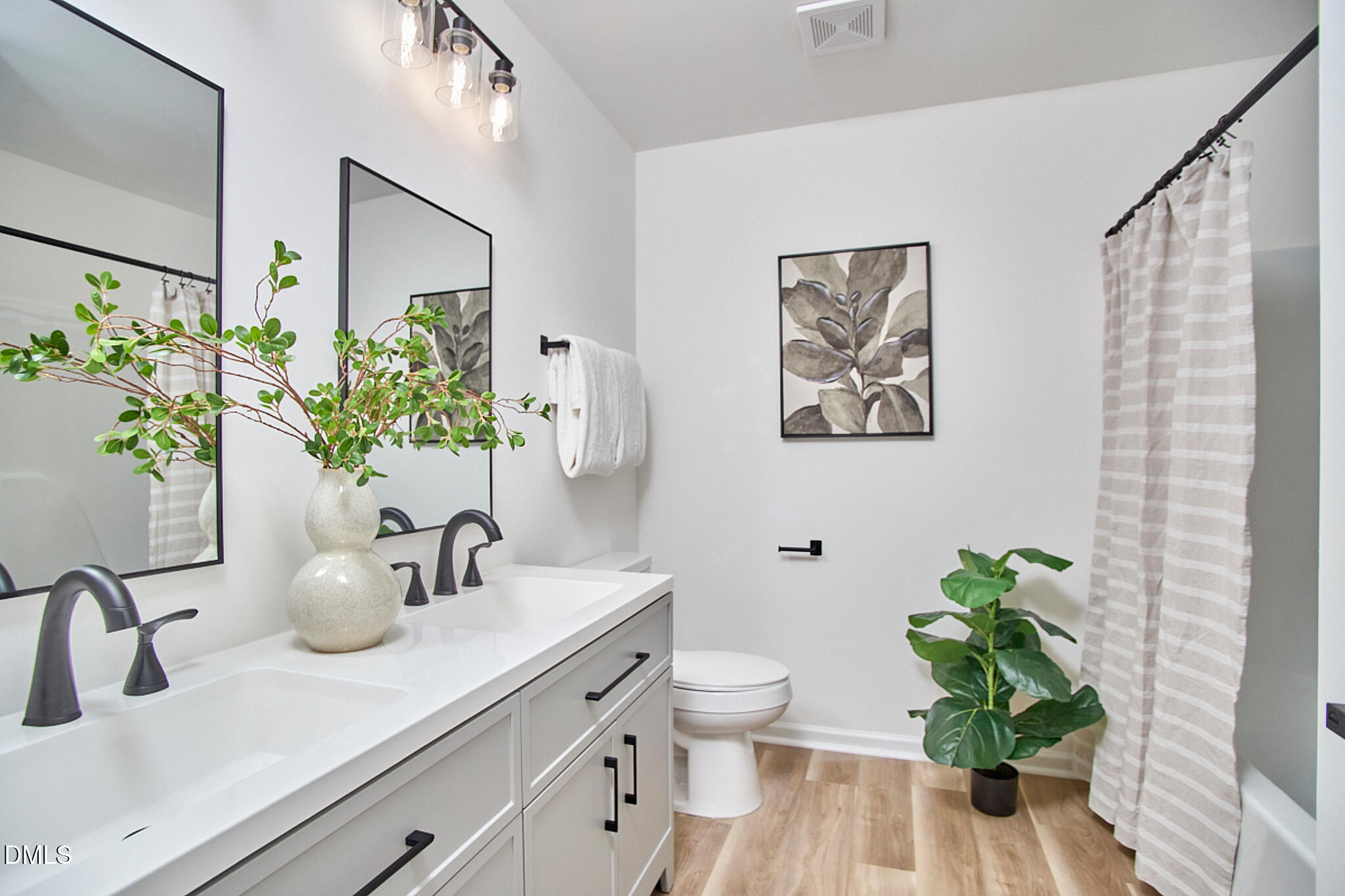 30 Fashion Place Durham, NC 27705 - Photo 25 of 30 a bathroom with a sink a toilet and a mirror