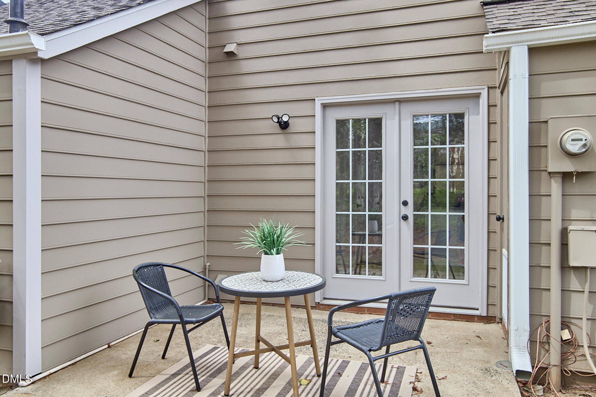30 Fashion Place Durham, NC 27705 - Photo 28 of 30 a patio with table and chairs and potted plants