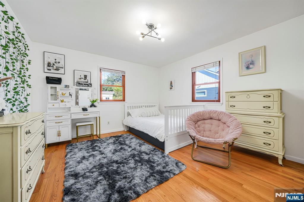 36 Clara Street North Haledon, NJ 07508 - Photo 13 of 31 a living room with furniture and paintings on the wall