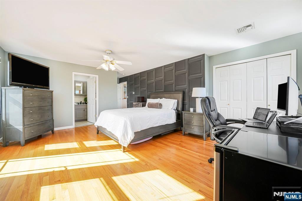 36 Clara Street North Haledon, NJ 07508 - Photo 21 of 31 a bedroom with a bed and a flat screen tv