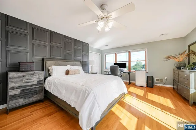 a bed room with a bed and a view of bedroom