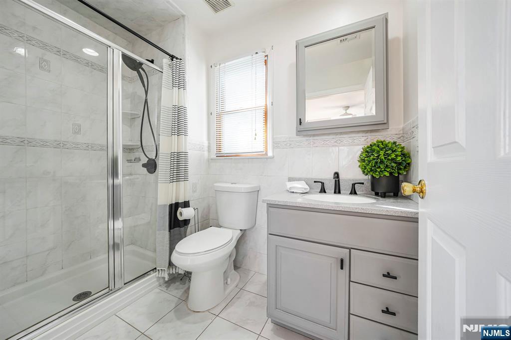 36 Clara Street North Haledon, NJ 07508 - Photo 23 of 31 a bathroom with a sink toilet and shower