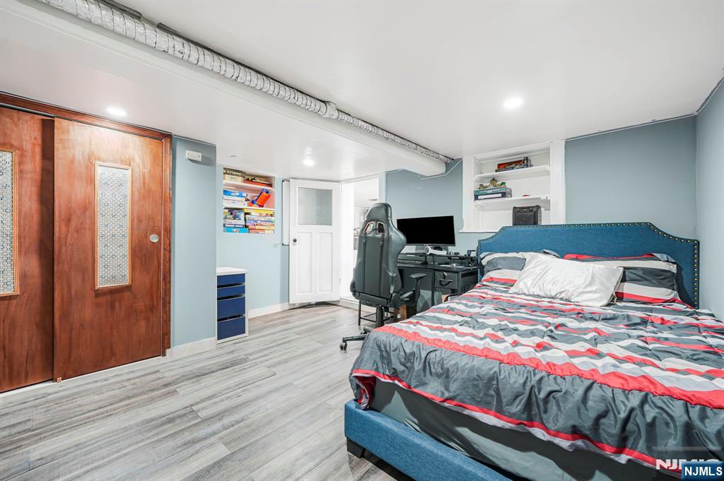 36 Clara Street North Haledon, NJ 07508 - Photo 25 of 31 a bedroom with bed and wooden floor