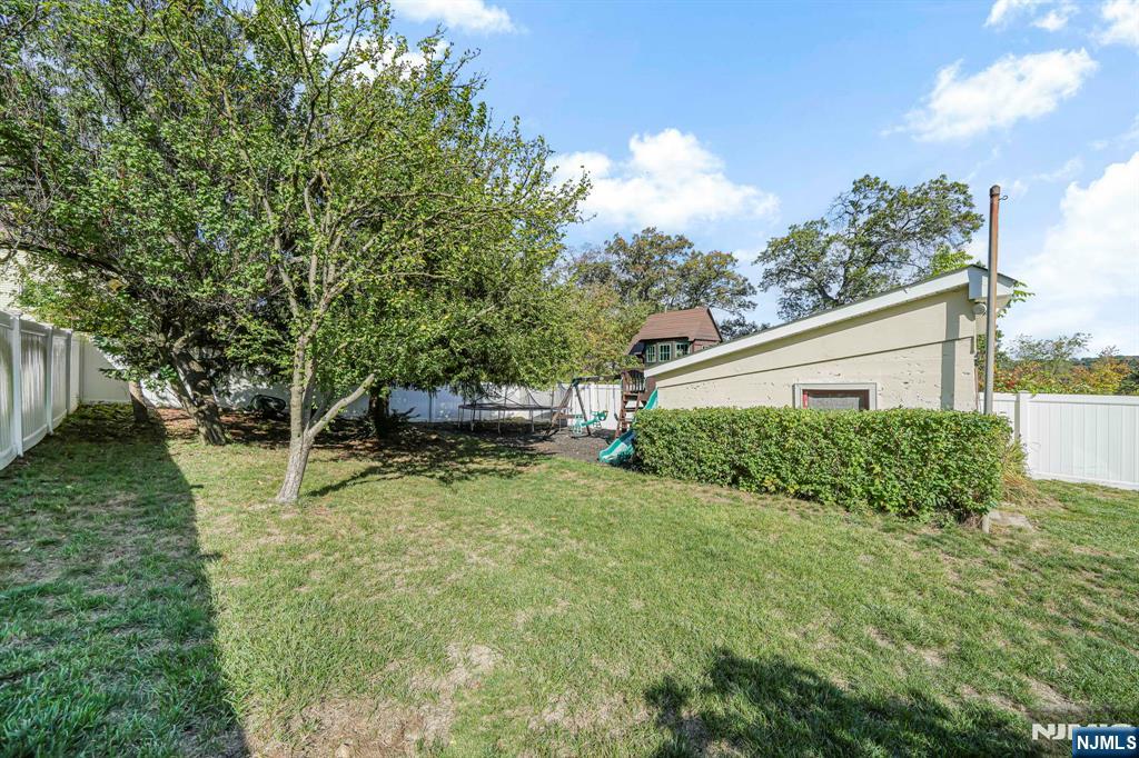 36 Clara Street North Haledon, NJ 07508 - Photo 28 of 31 a view of a house with backyard and garden