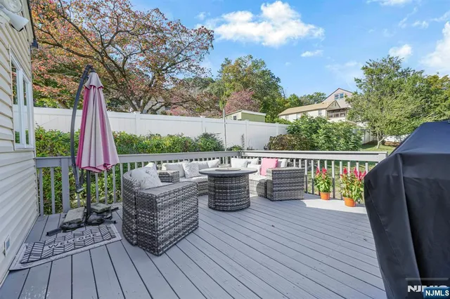 a view of a deck with couches table and chairs
