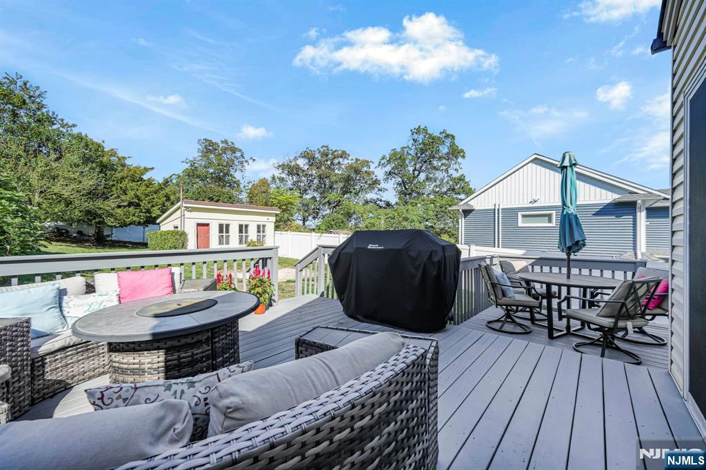 36 Clara Street North Haledon, NJ 07508 - Photo 30 of 31 a roof deck with table and chairs