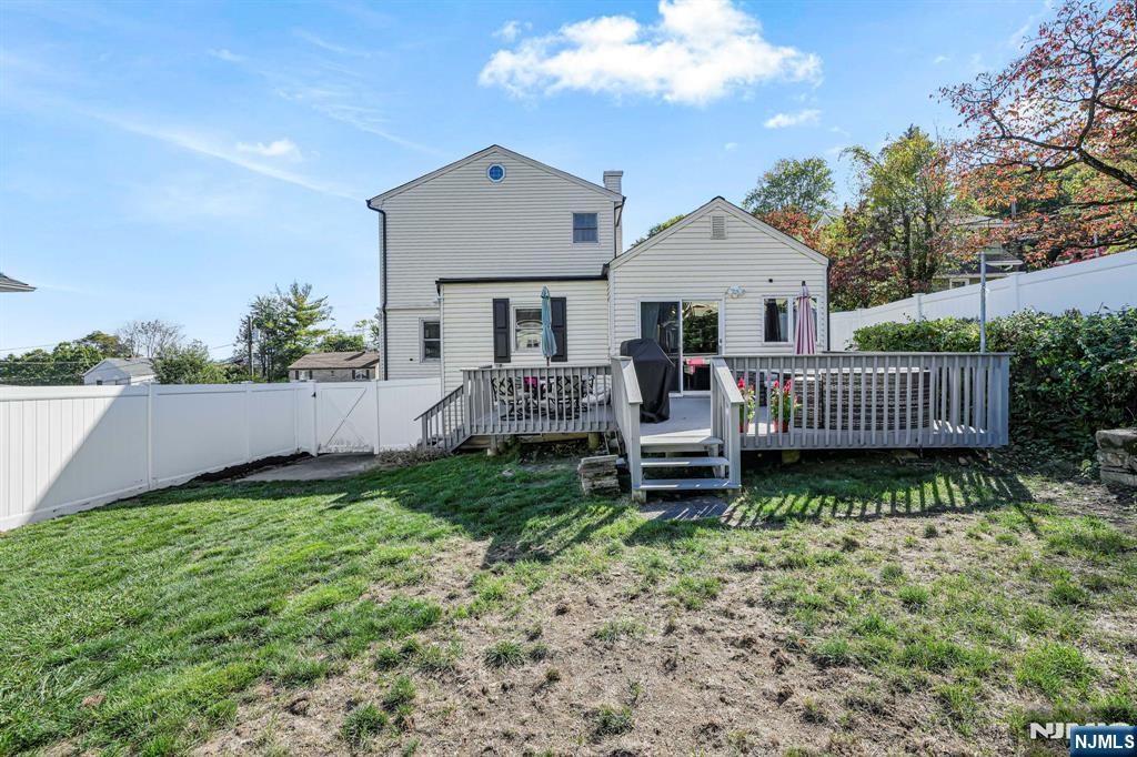36 Clara Street North Haledon, NJ 07508 - Photo 31 of 31 a view of a house with a yard and deck