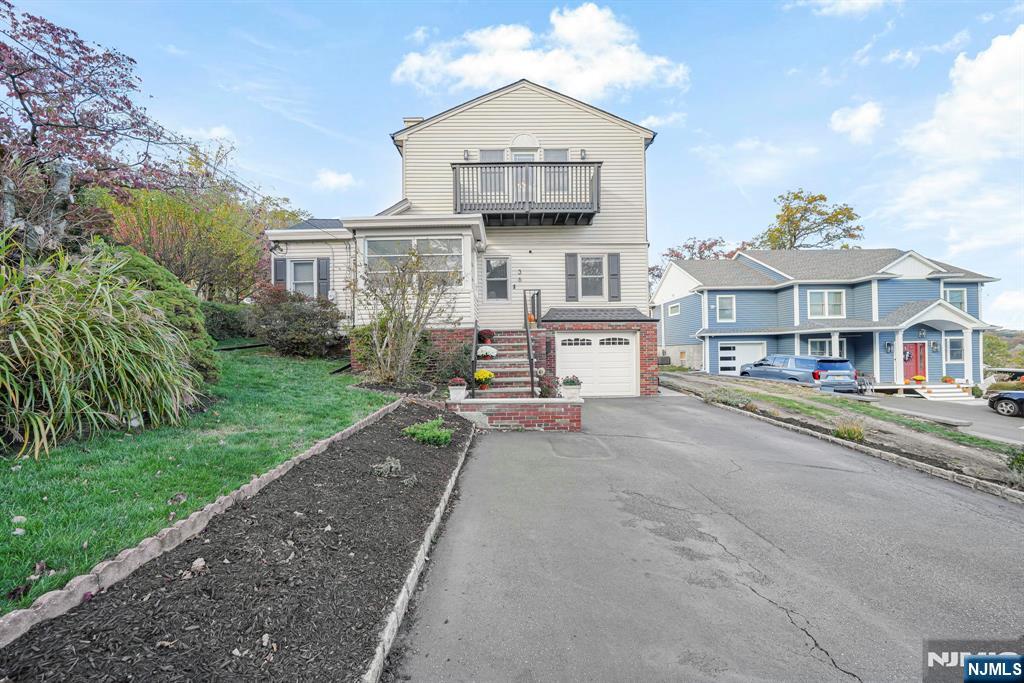36 Clara Street North Haledon, NJ 07508 - Photo 8 of 31 a view of a house with a yard and sitting area