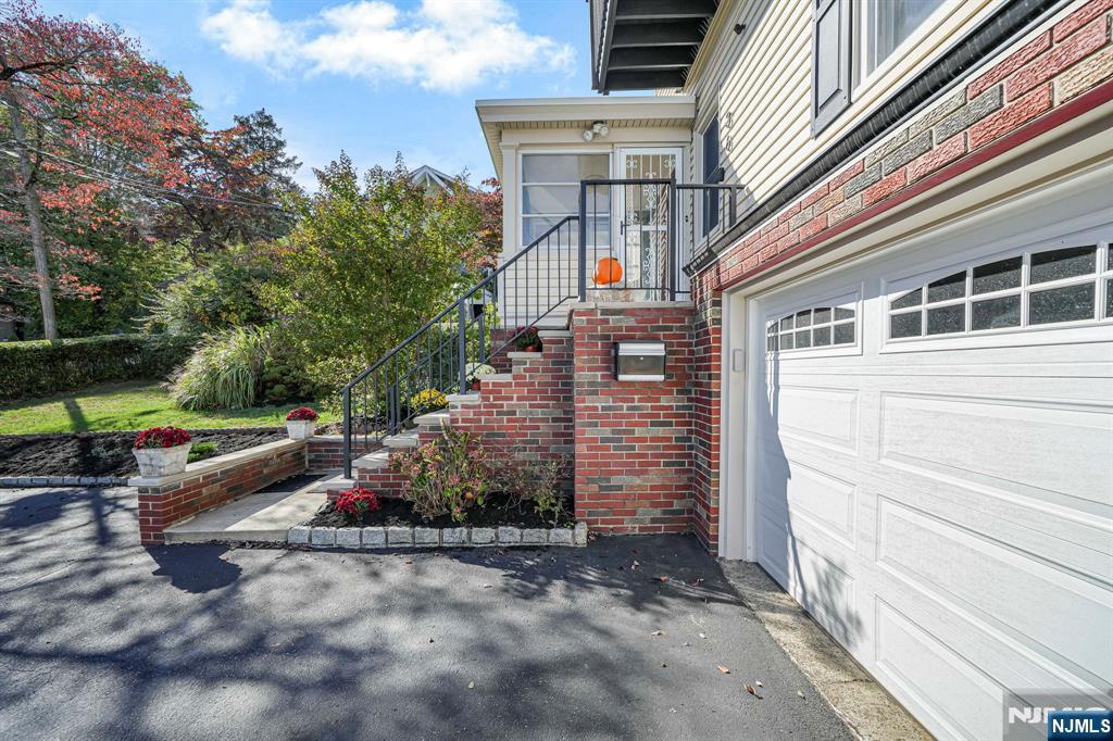 36 Clara Street North Haledon, NJ 07508 - Photo 9 of 31 a view of backyard with plants and trees
