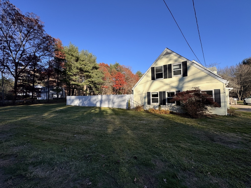 258 Walnut Street, Unit 1 Bridgewater, MA 02324 - Photo 1 of 19 a front view of a house with a garden