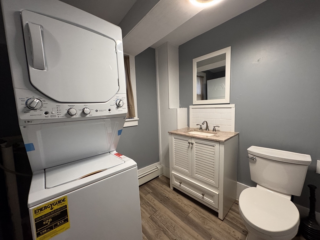 258 Walnut Street, Unit 1 Bridgewater, MA 02324 - Photo 17 of 19 a bathroom with a toilet sink and mirror