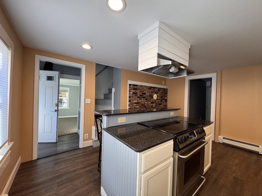 258 Walnut Street, Unit 1 Bridgewater, MA 02324 - Photo 7 of 19 a kitchen that has a sink and a stove top oven
