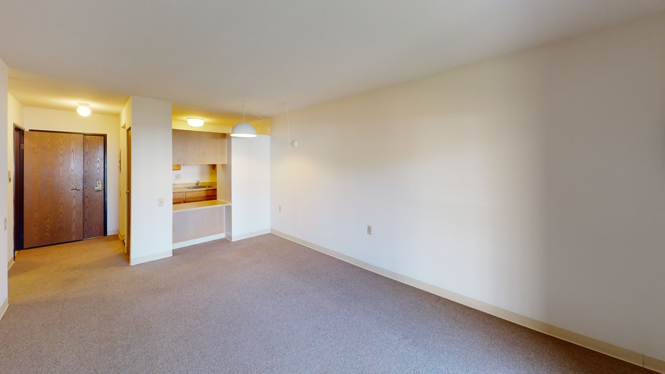 26377 Ryan Road Warren, MI 48091 - Photo 4 of 6 a view of empty room with kitchen