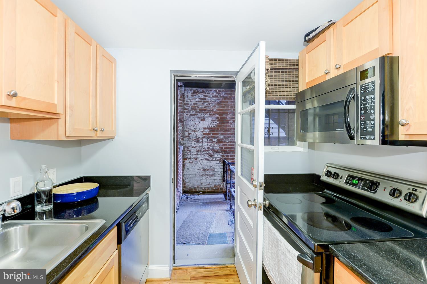 1737 P Street Northwest, Unit 201 Washington, DC 20036 - Photo 14 of 15 a kitchen that has a sink and a stove