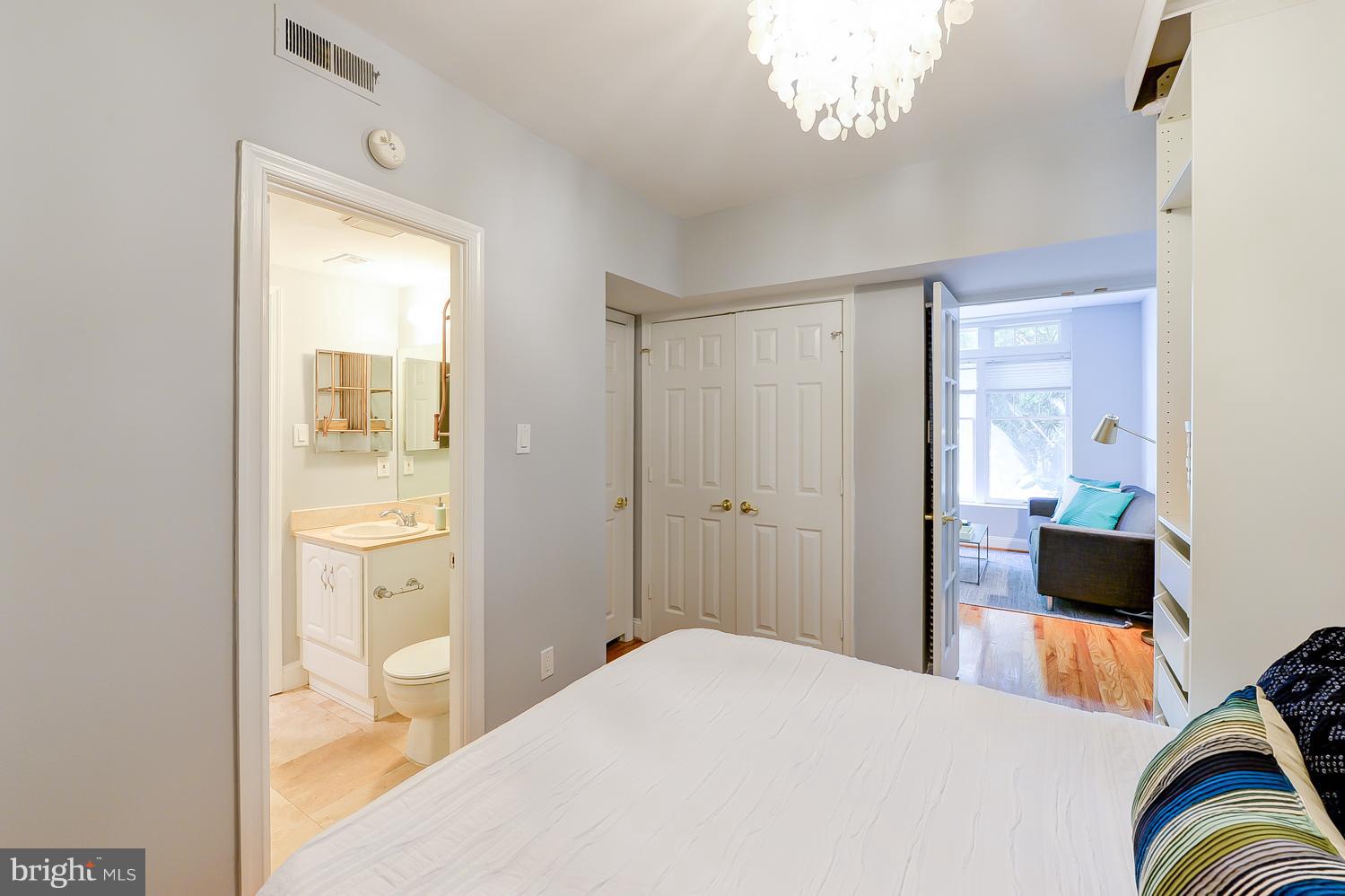 1737 P Street Northwest, Unit 201 Washington, DC 20036 - Photo 10 of 15 a bedroom with a bed and a couch