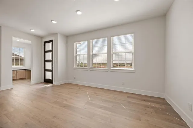 a kitchen with a sink and large window