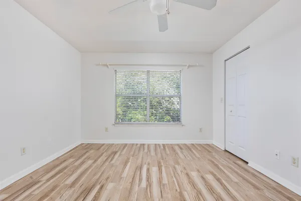 a view of room with window and hardwood floor