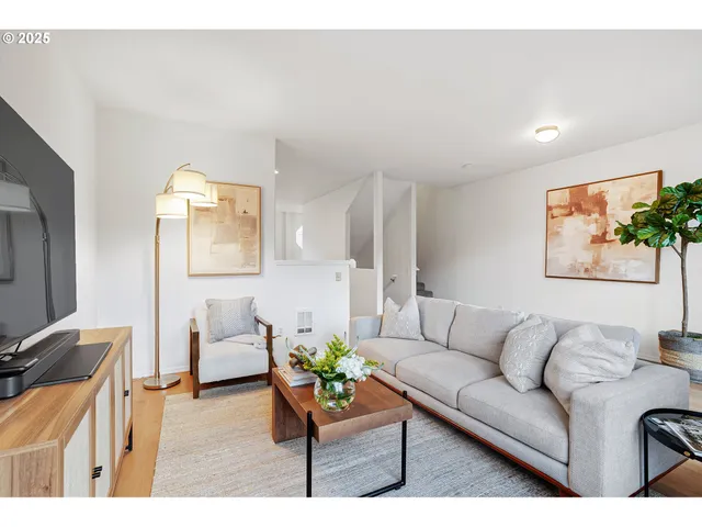 a living room with furniture and a couch